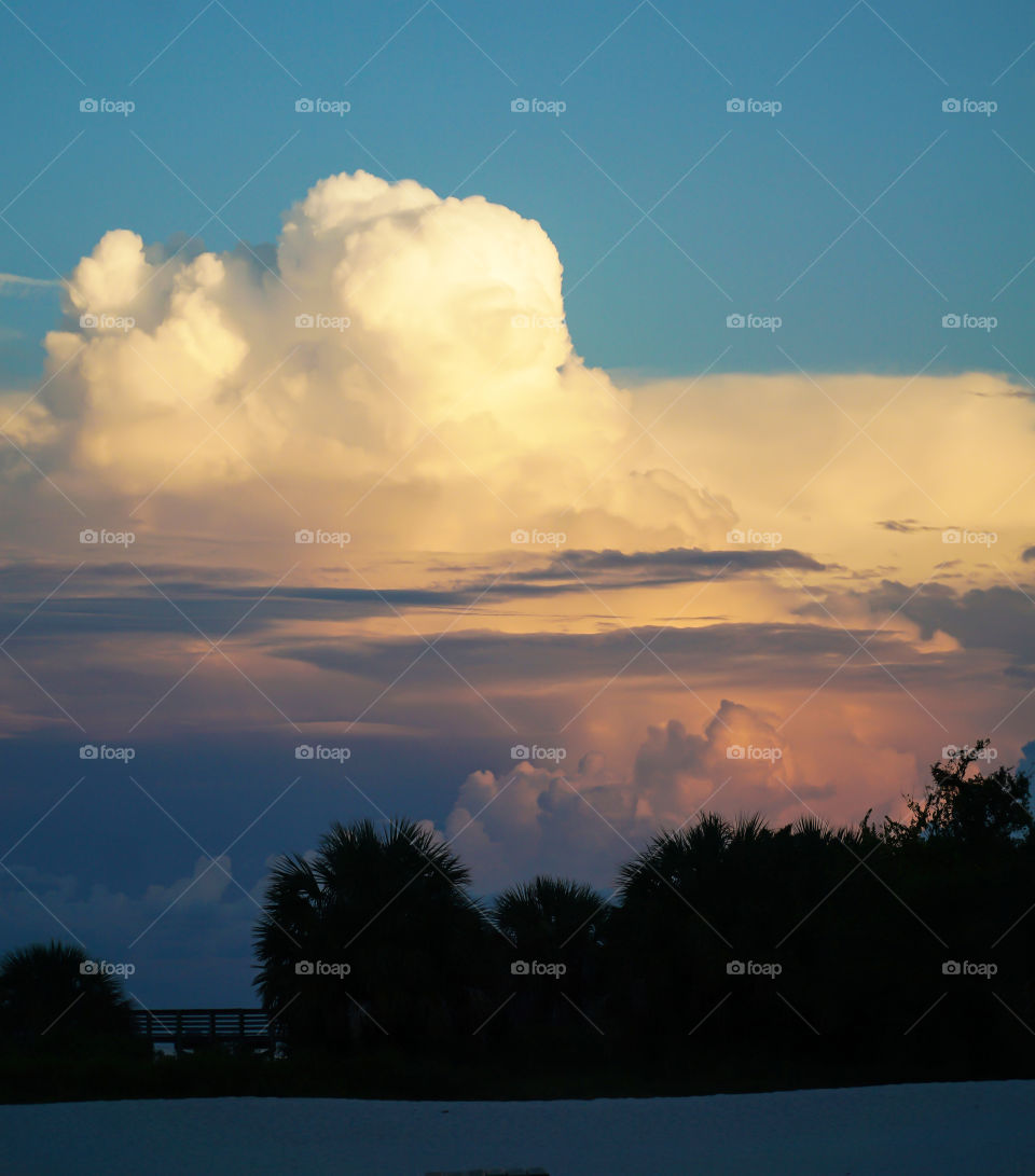 Sunrise through cumulus clouds