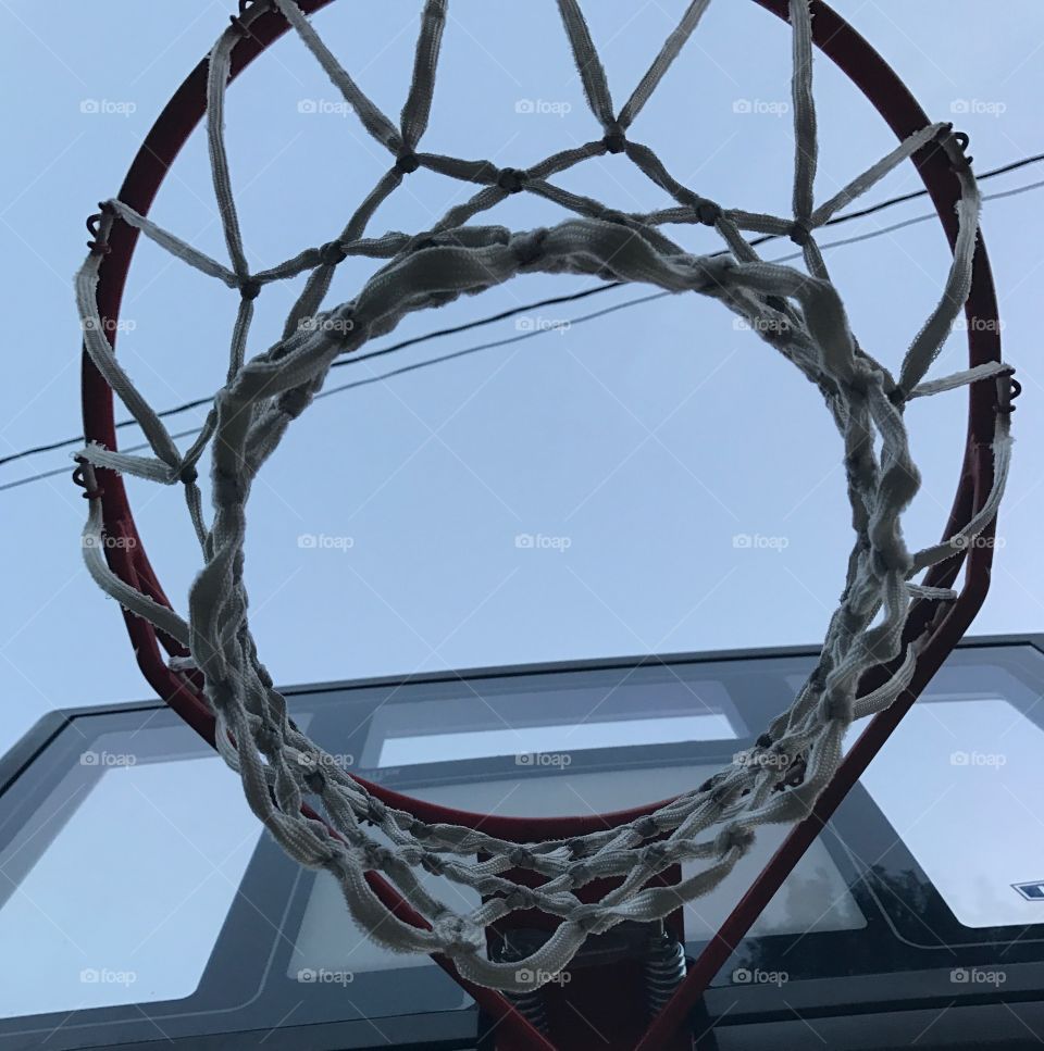Lines and designs made by basketball goal from underneath 