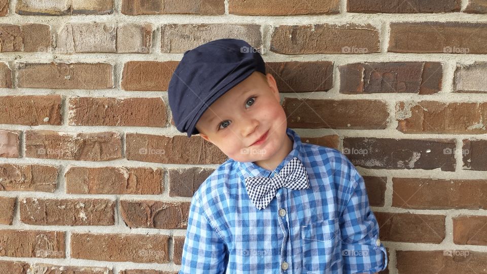 Cute boy,  brick wall. my son on the day he turned 3