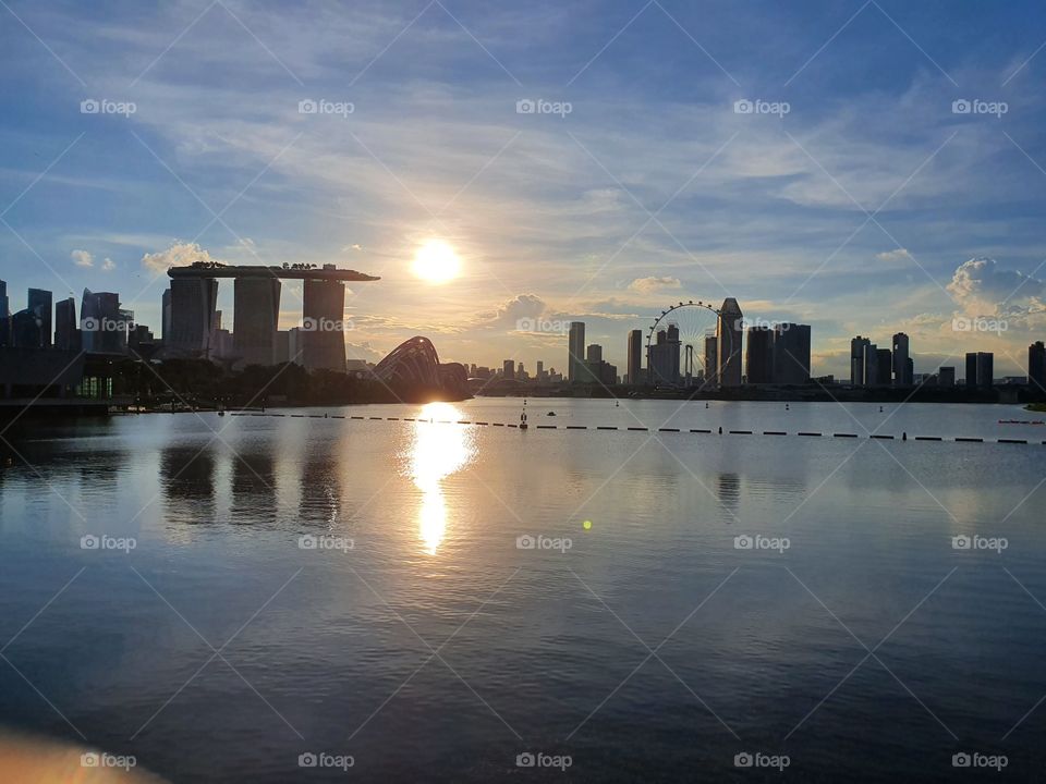 Sunset by the bay with sunlight reflect on the water in Singapore