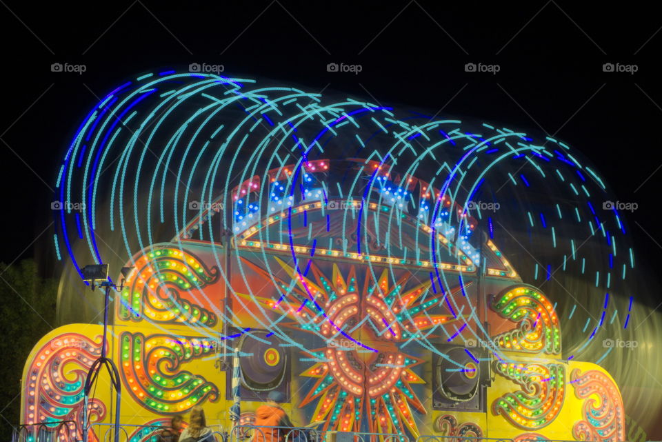 carnival ride night light swirling colors time lapse long exposure colorful fun people summer