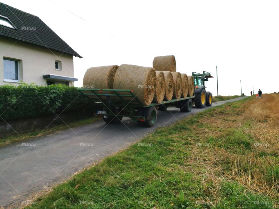 Tractor with straw bales