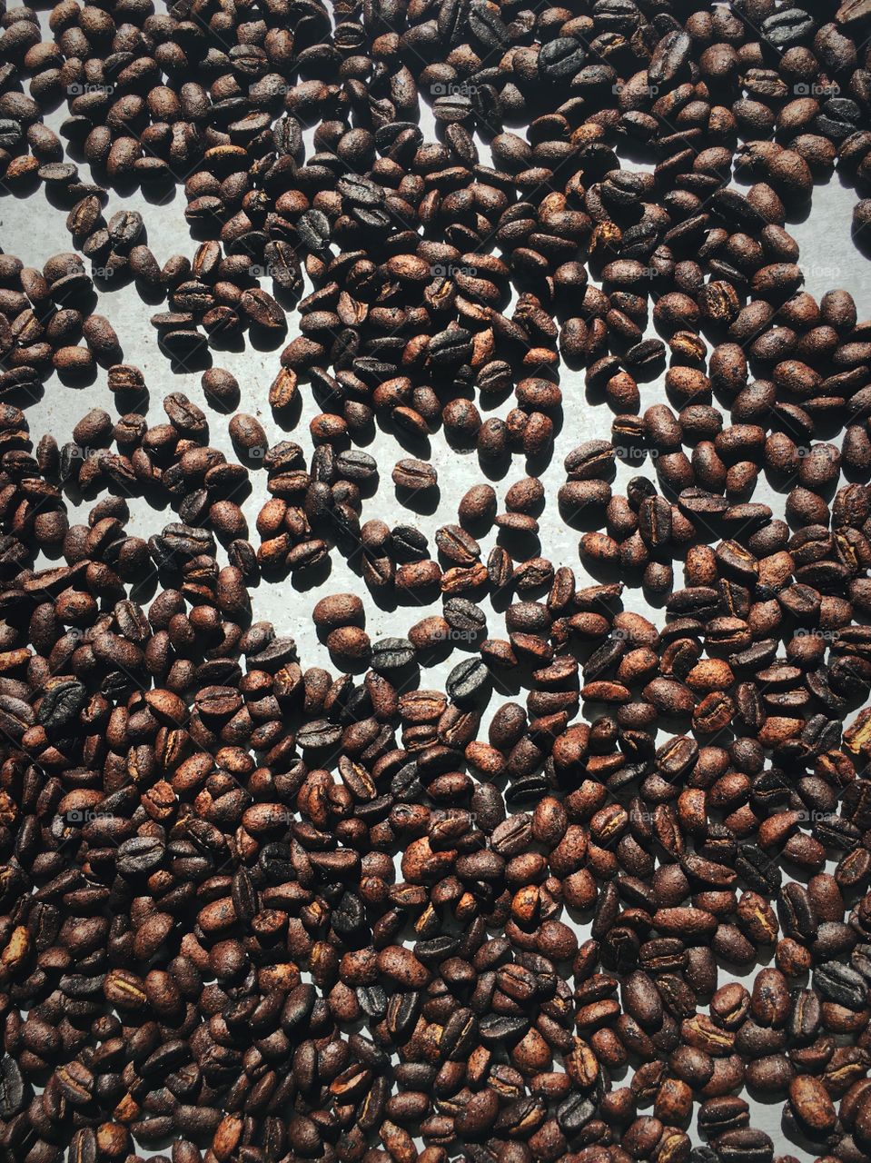 A batch of coffee beans we roasted ourselves with our hosts at a traditional coffee farm in the mountains outside of Trinidad, Cuba! 