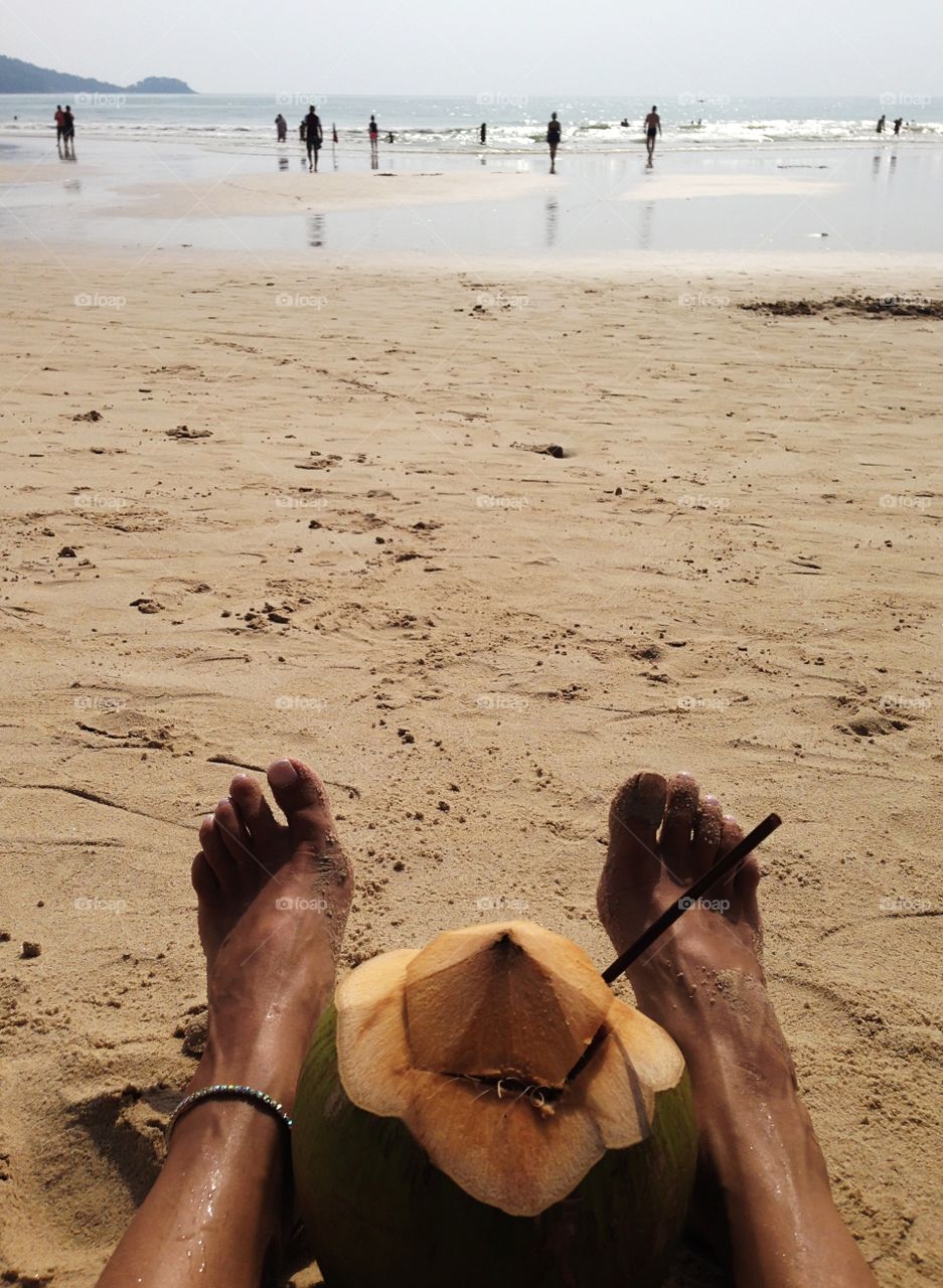 Enjoying the last summer days at the beach with the coconut cocktail 