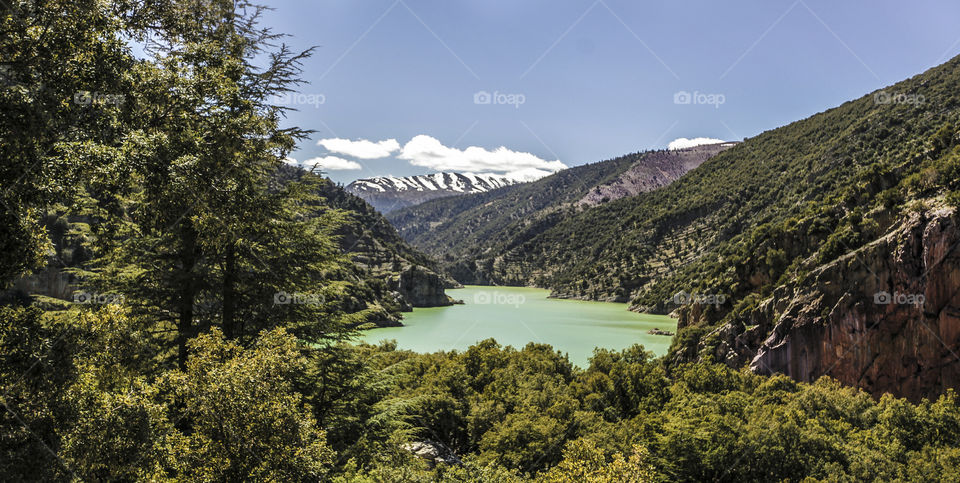 Lake in the north of Morocco and skiing covering mountains