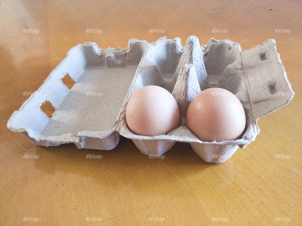 Two eggs in a carton