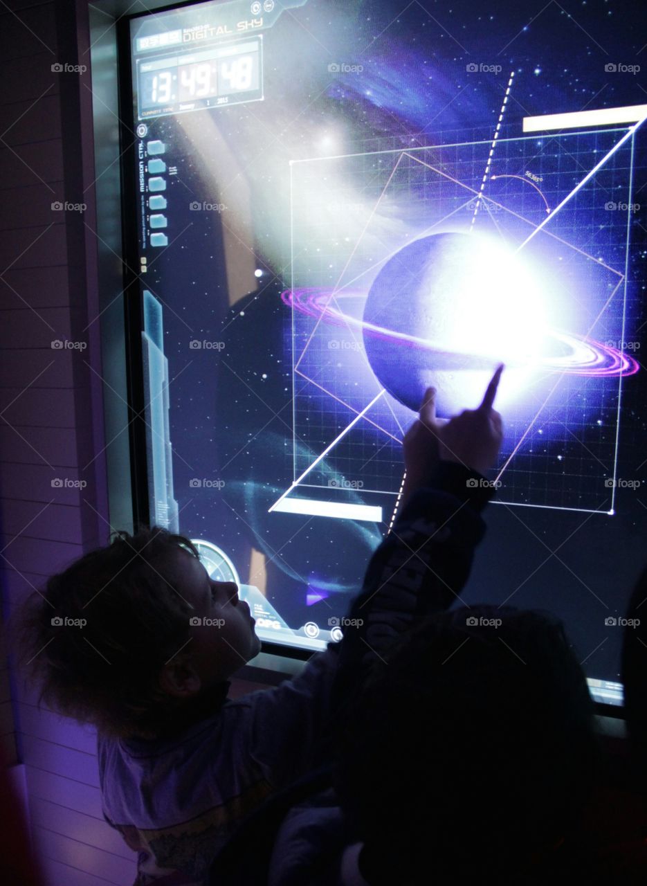 Kids interacting with a display at Space Module, Pearl Tower, Shanghai, China