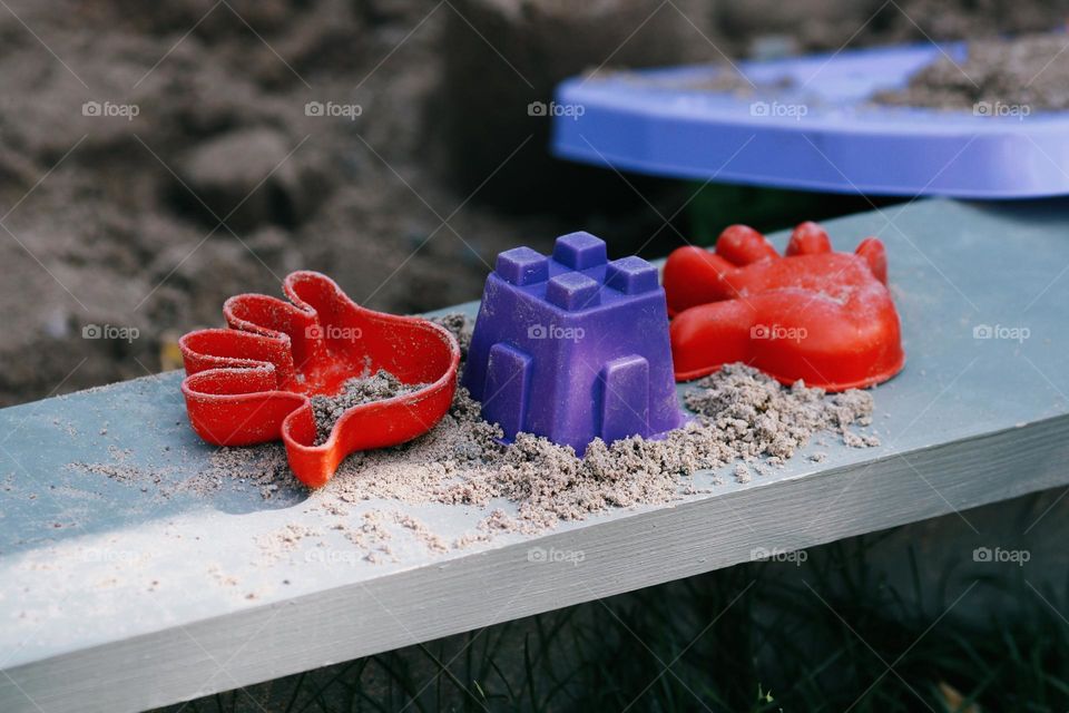 Colourful child’s toys in playground, nobody 