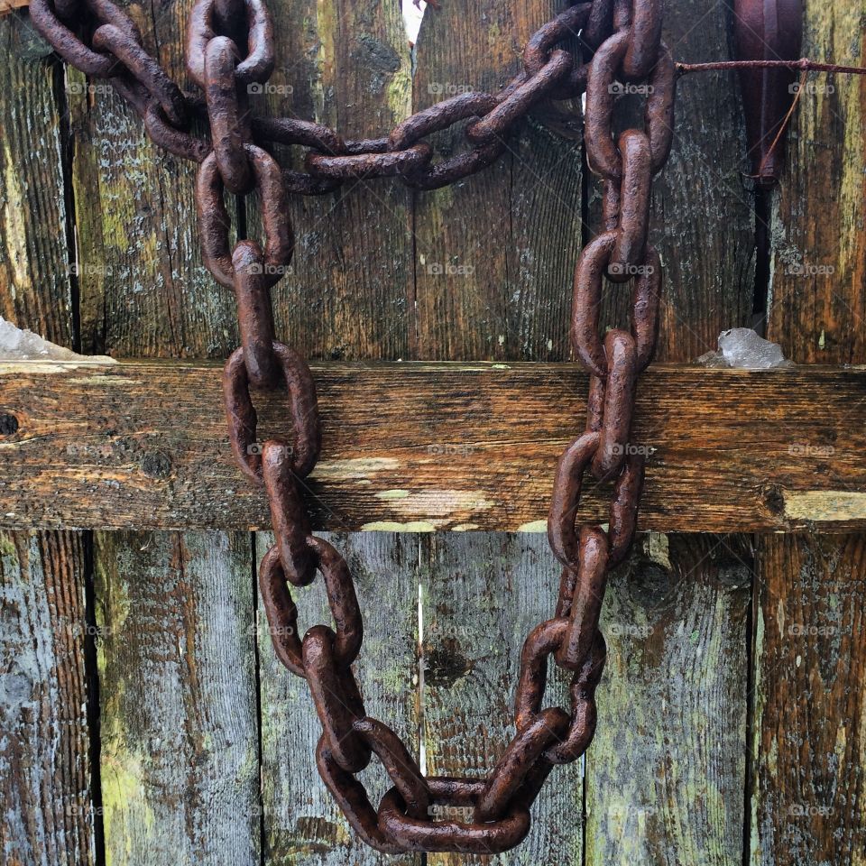 Never break the chain. Chain on fence