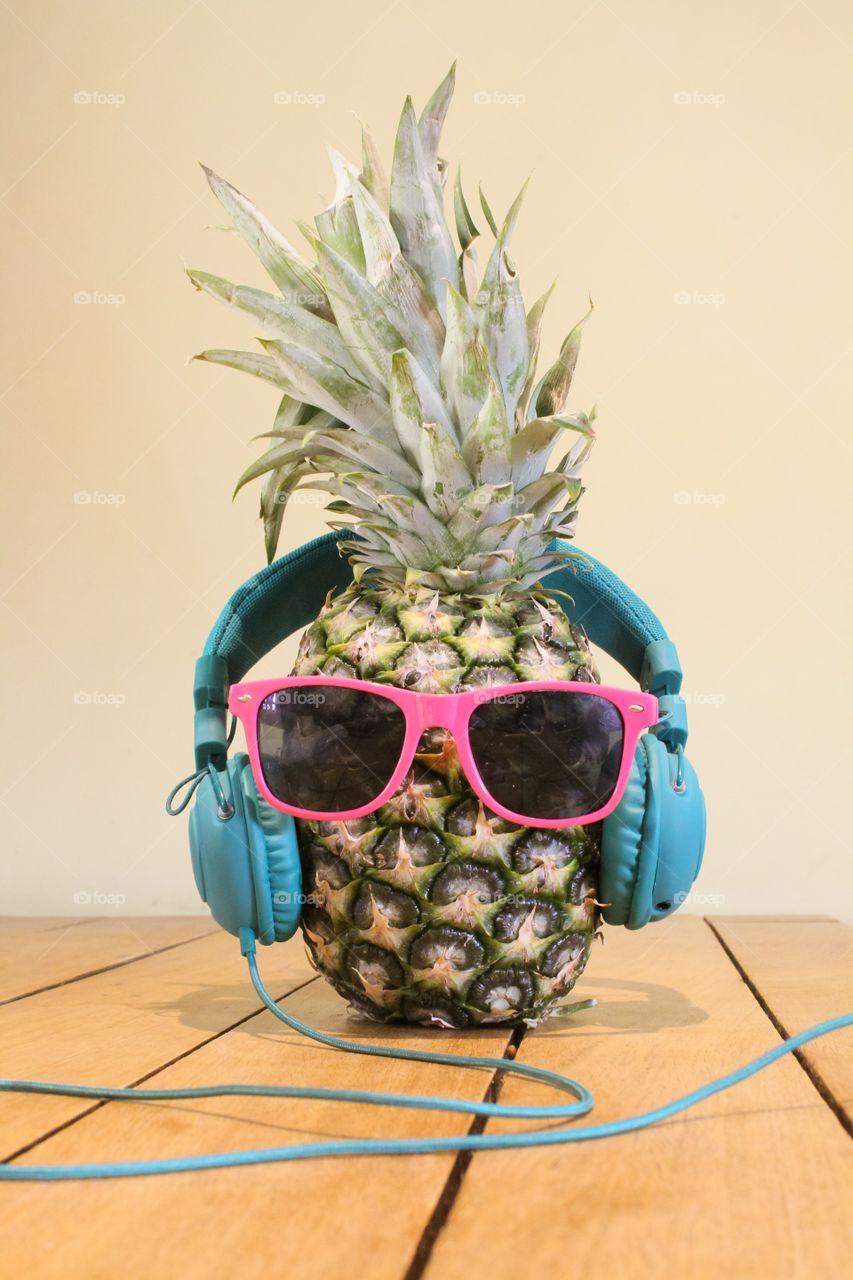 Pineapple wearing sunglasses and headphones