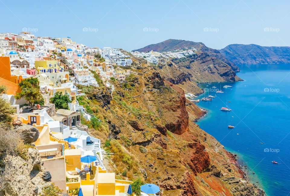 Town by sea against sky
in Oia