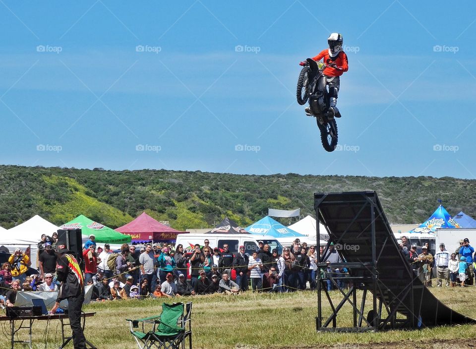 Motorcycle Stunt. Jumping A Motorcycle Off A Ramp
