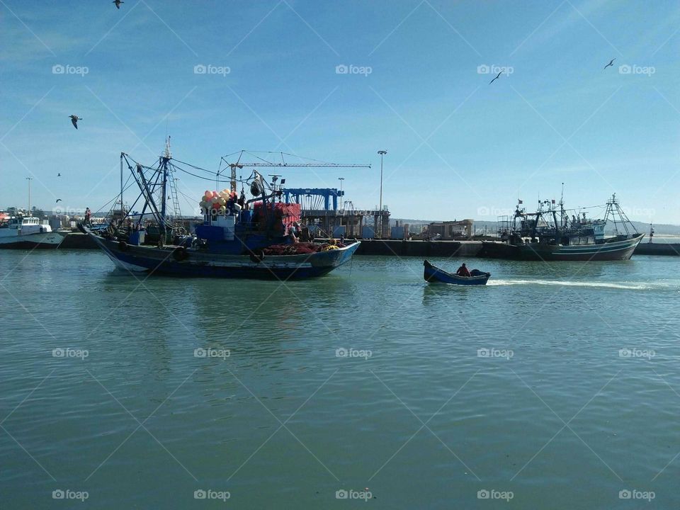 Ships and boats in harbor.