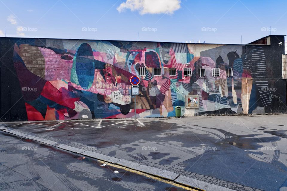 Colorful abstract graffiti on the facade of the Florenc metro station building in Prage, Karlin.