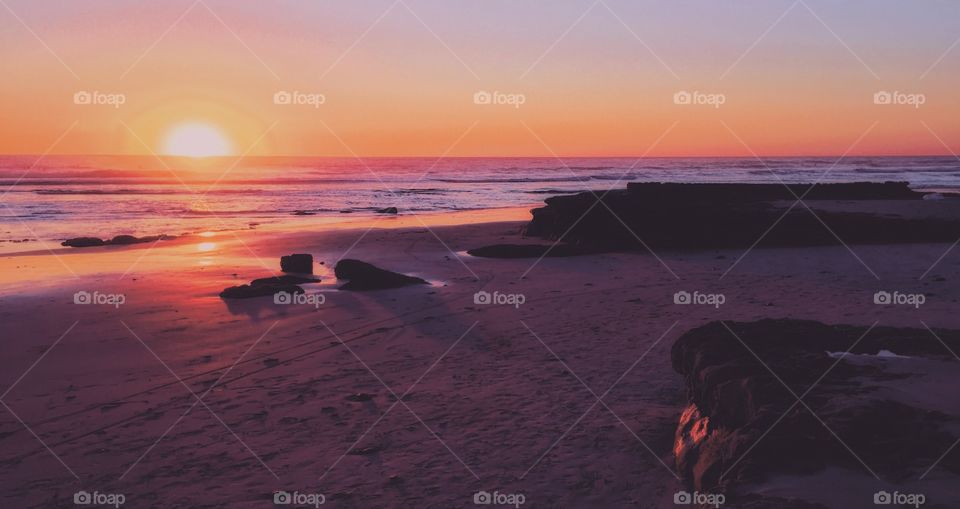 Orange and lavender sunset on the beach