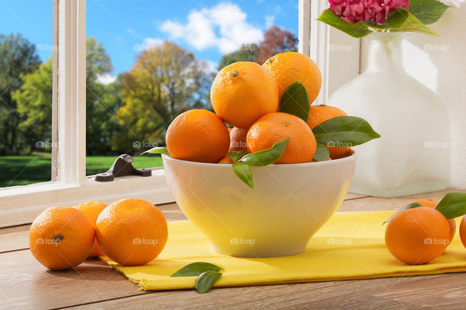 Fresh oranges on a kitchen table