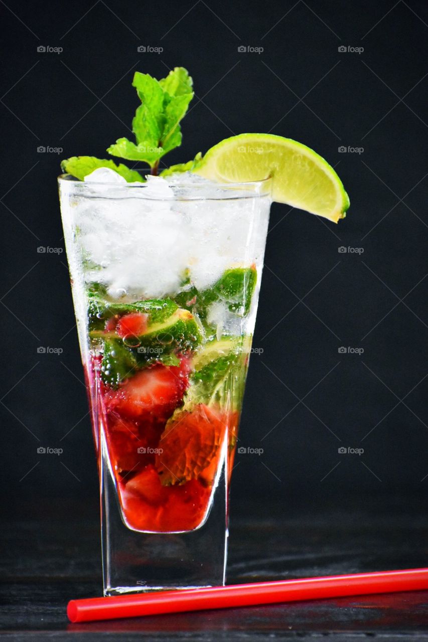 Strawberry mojito garnished with mint and a lime wedge