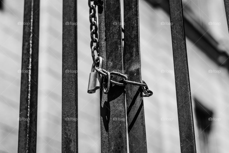 Padlock hanging on chains