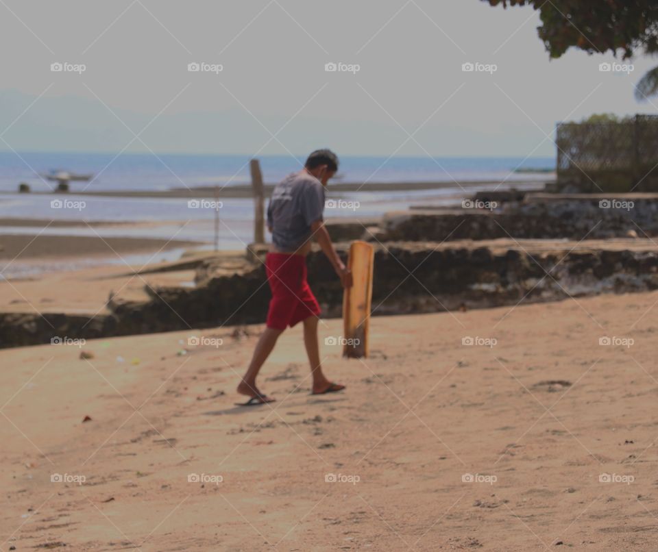 A man walking at the beach