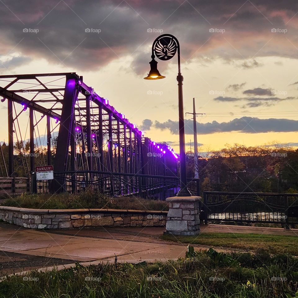 sunset crossing the foot bridge