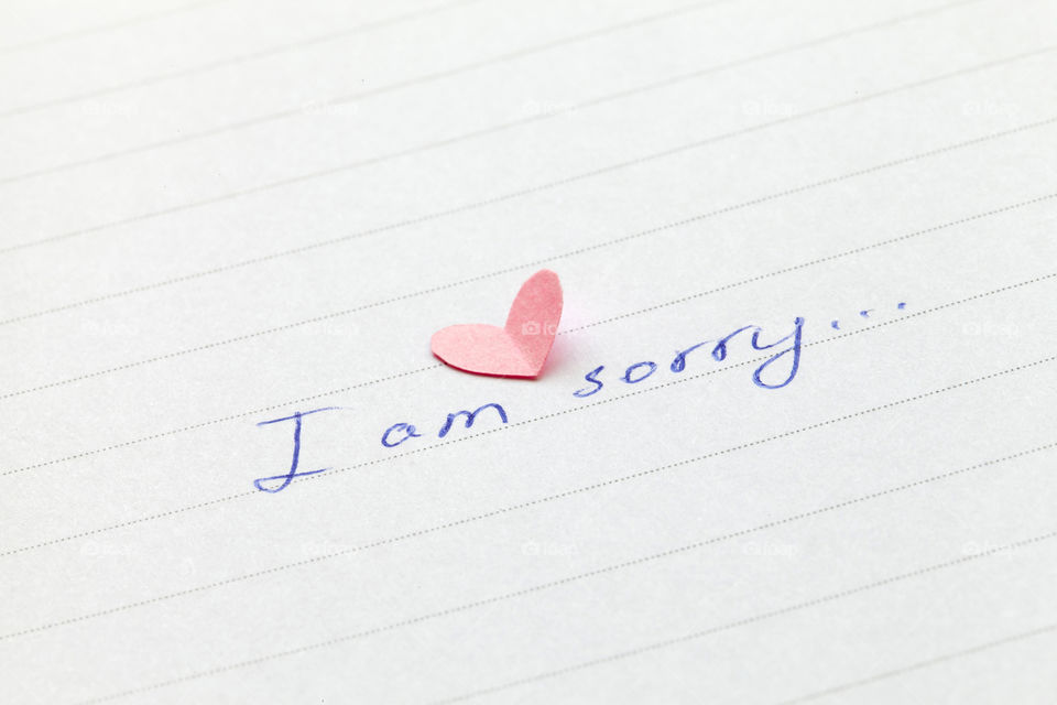 Handwritten phrase 'I am sorry'