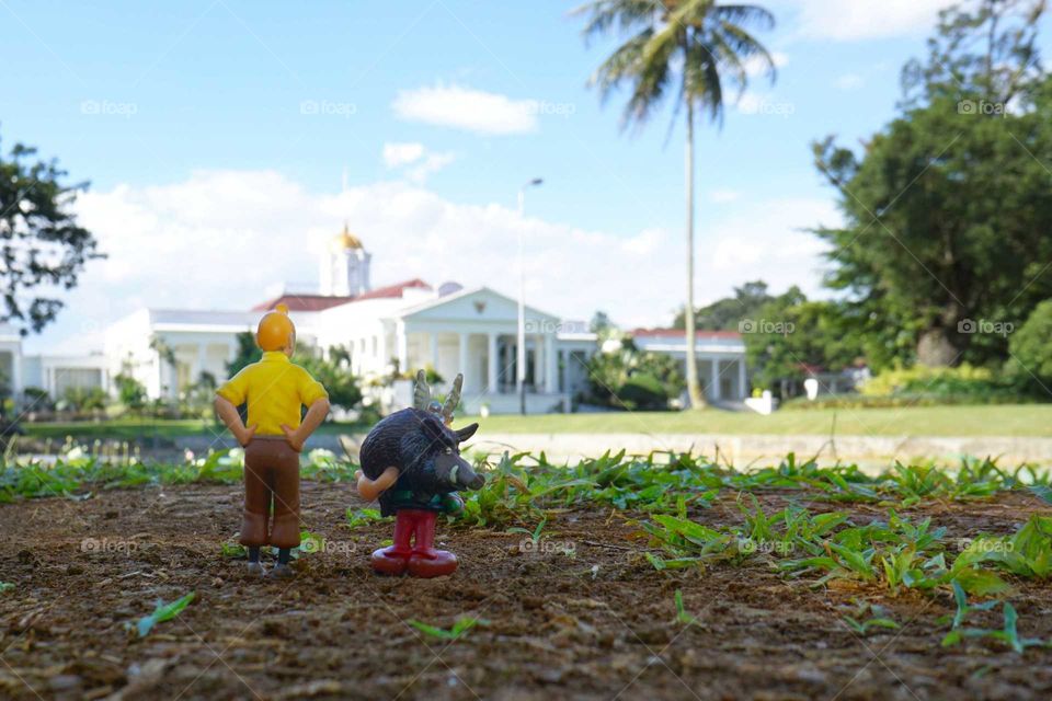 Tintin and Asterix figurine in front of Indonesia presidential palace of Bogor, West Java, Indonesia