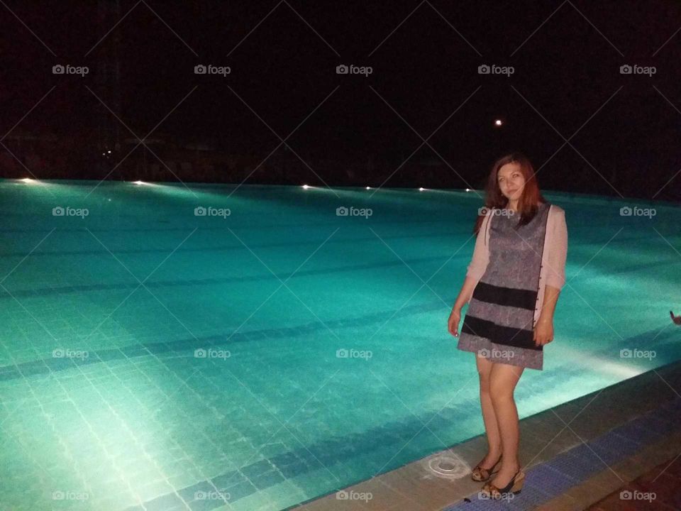 in the pool at night