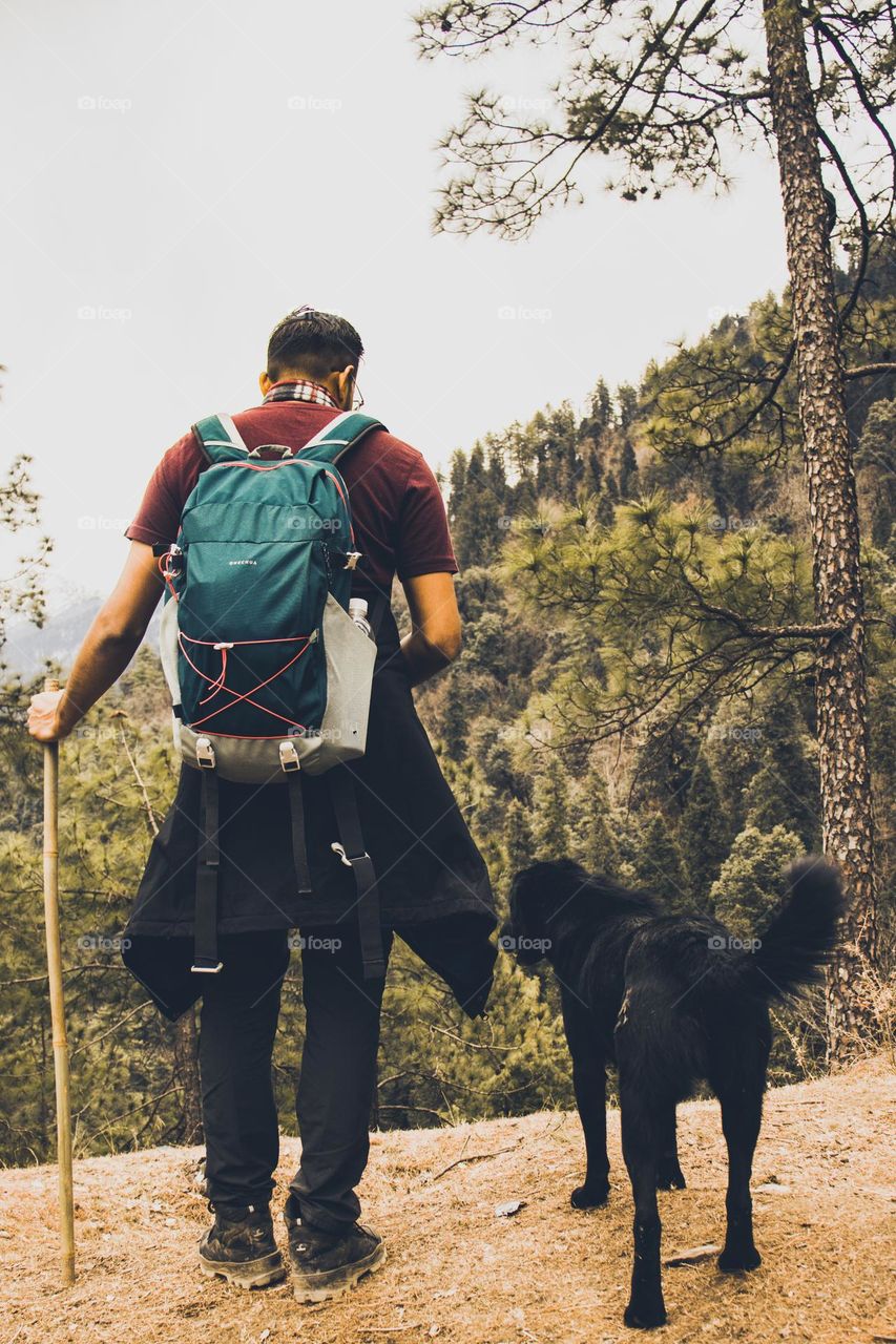 a man going to track with dog