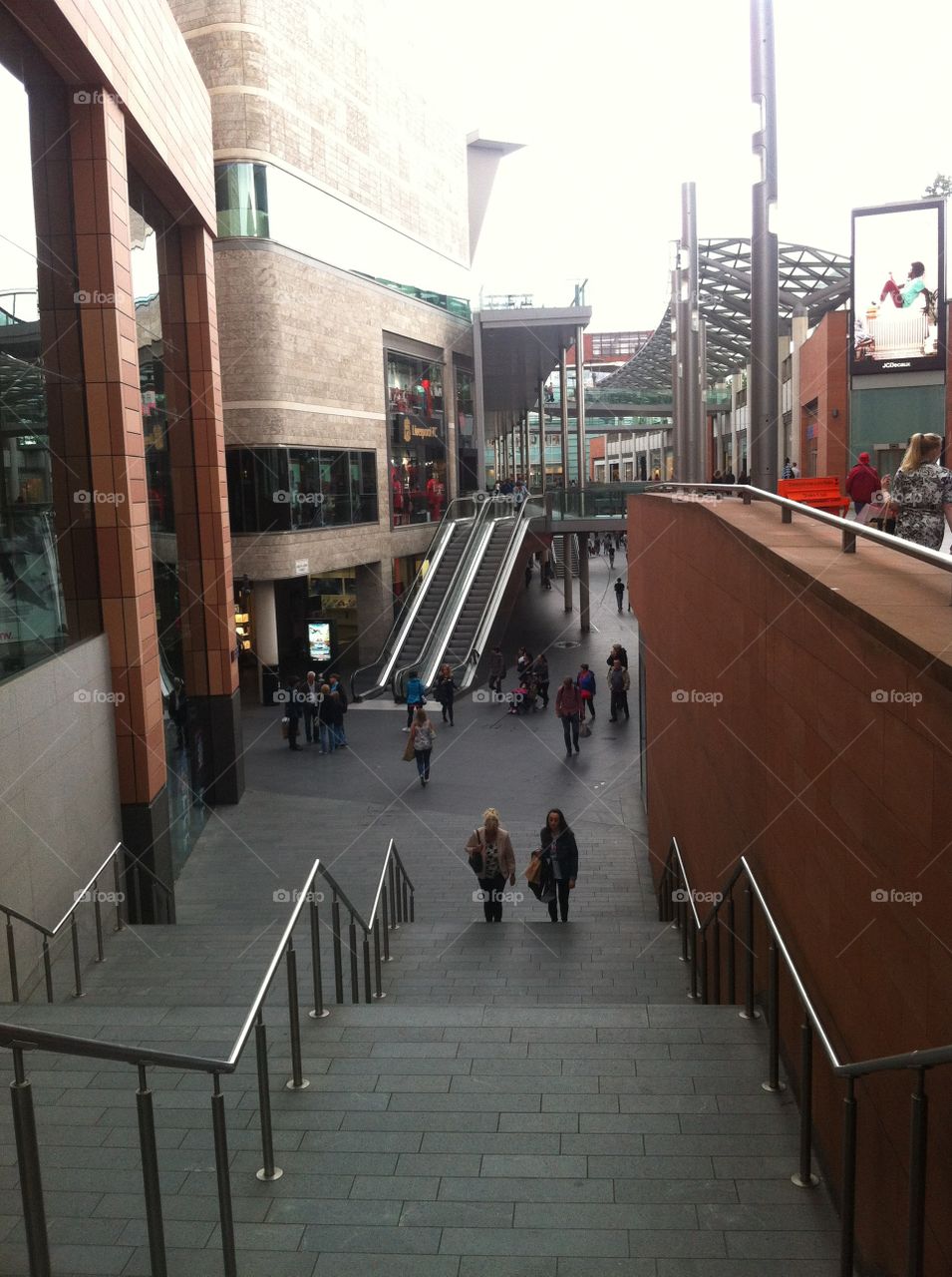 Escalator in street . And buildings
