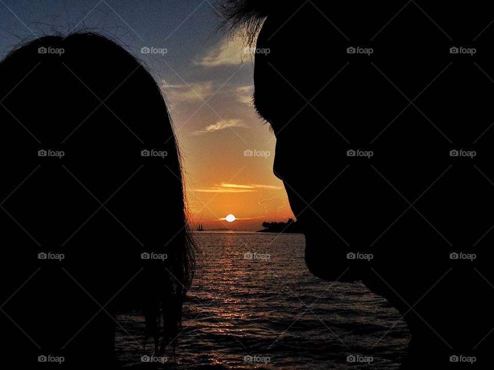 Sunset between lovers. Romantic sunset between a couple of lovers