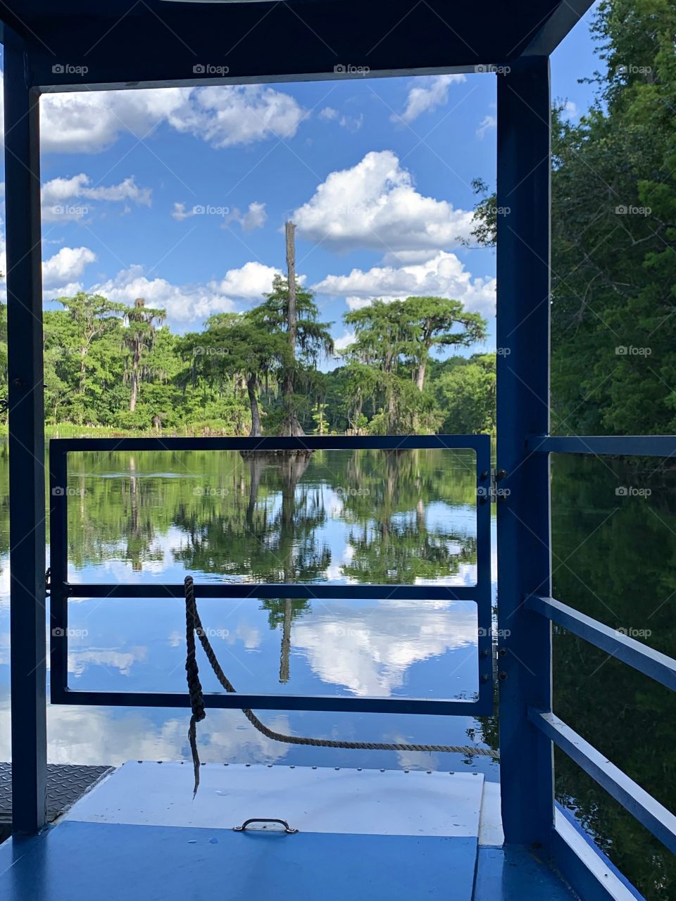 View from the window of a boat. Framing the photo draws focus to the subject in the photo by blocking other parts of the image with something in the scene