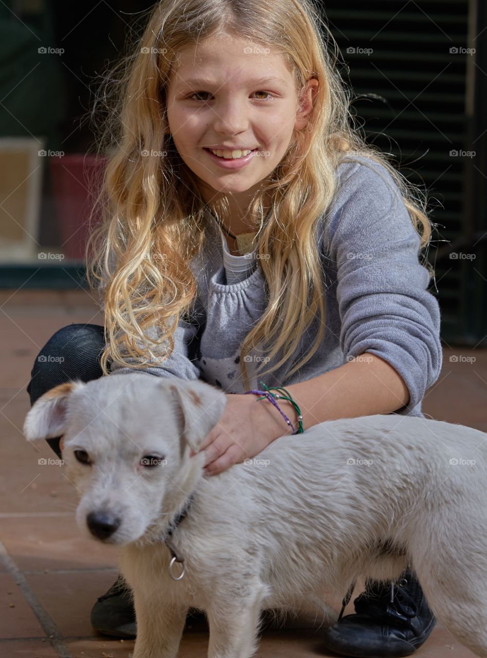 Girl sitting with dog