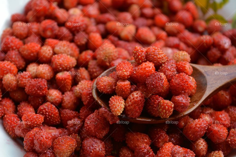 red strawberries on a plate tasty healthy summer food background