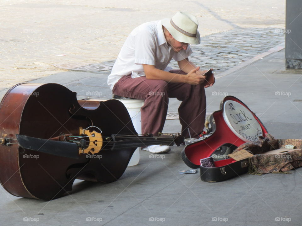 Street Musician. An artist's life on the street, playing a tune for a buck