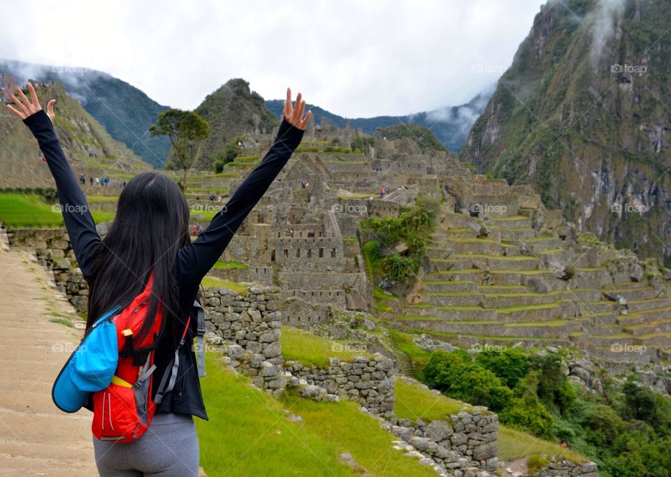 Young woman seeing Machu Picchu