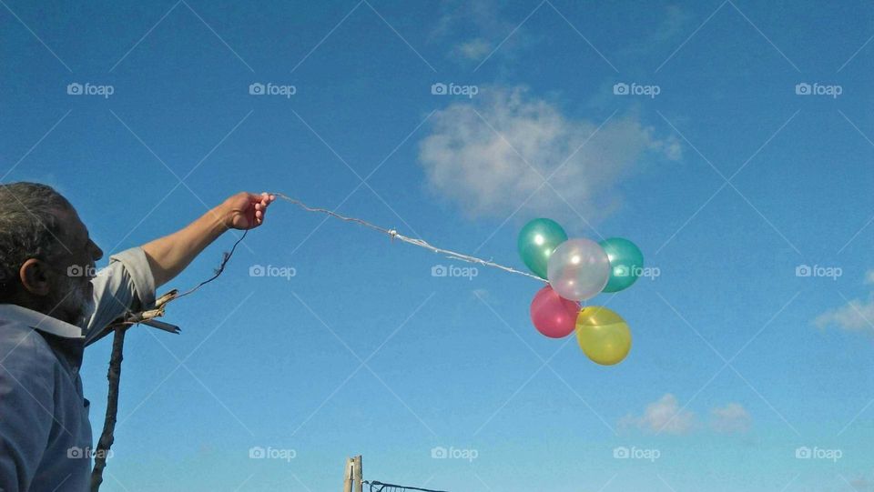 The beautiful balloons embraced blue sky