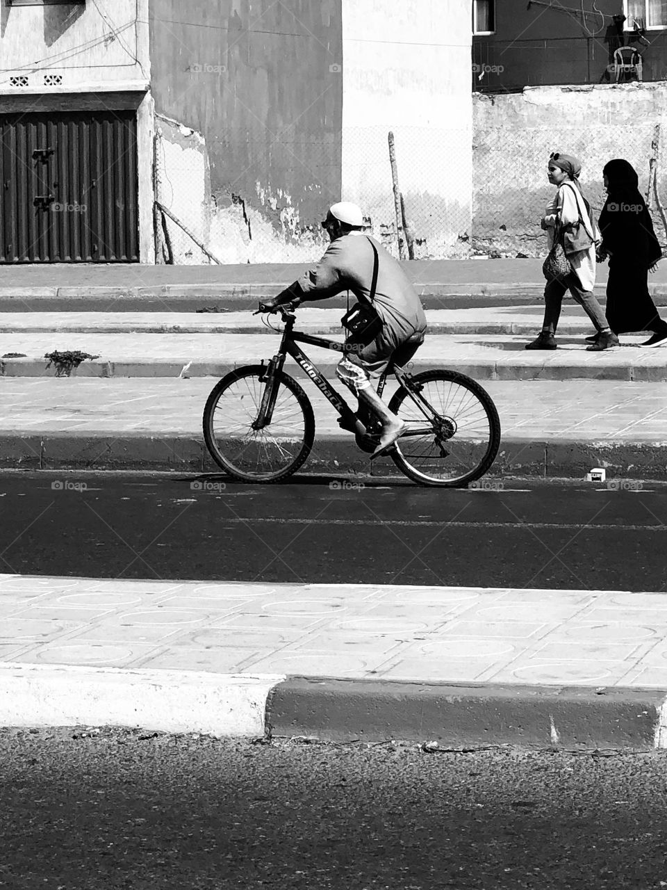 The man on bicycle in the street at essaouira city in morocco 