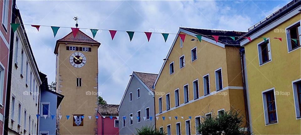 This is the beautiful old inner city of “Kelheim“, Bavaria on the „Danube“ with its well kept medieval facades and small flags strung across the square. 2024. Hypnotic Productions