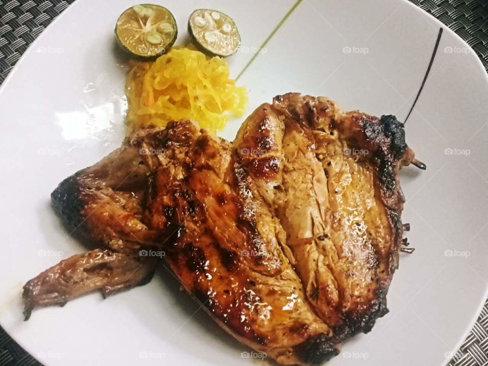 Filipino Chichen Inasal. Inasal – an Ilonggo term meaning "chargrilled" or "roasted meat" that was originated in the City of Bacolod, Philippines. Served with unlimited rice since Filipino loves to eat rice. Proud Filipino.