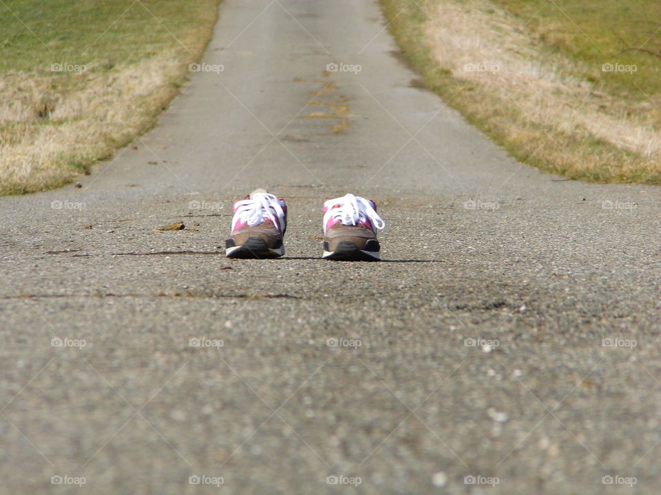 One pair of shoes placed on the street