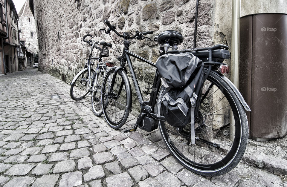 Bicycle wait to be ridden on a cobbled street