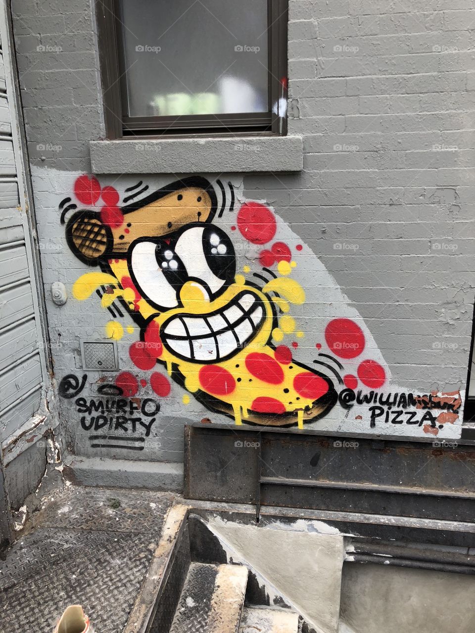 Smiling slice of pizza nyc street art