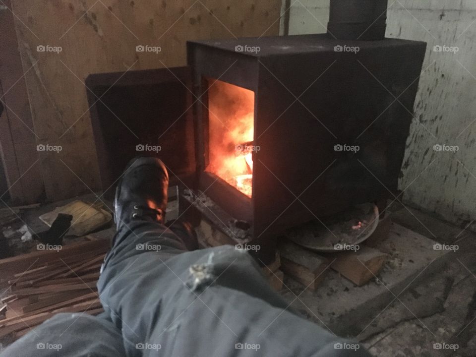 Warming up by the fire after a 1km hike through a foot and a half of snow. 