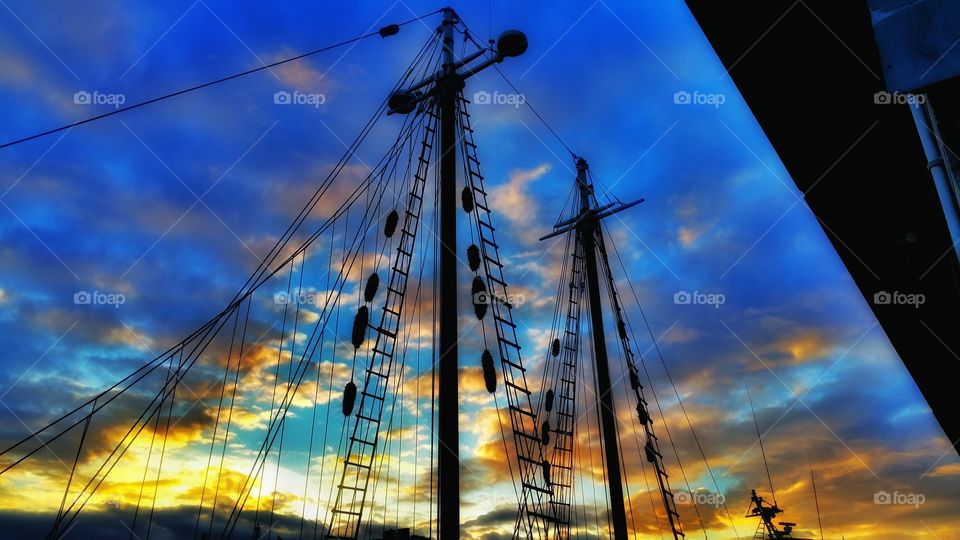 sailors delight. the beautiful night sky shows through the schooners mast