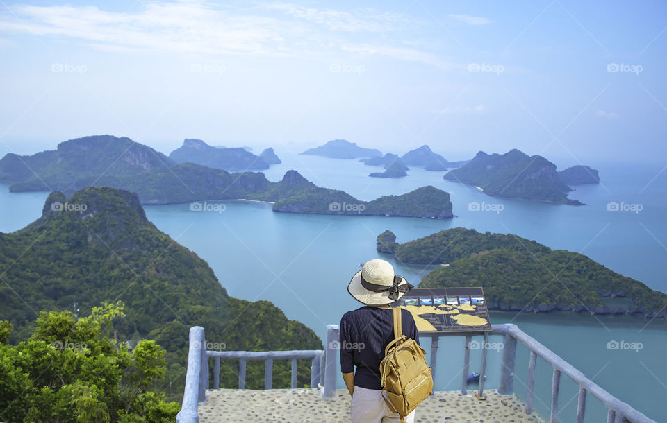 Women shoulder backpack on Pha Jun Jaras Viewpoint at Angthong Islands , Suratthani in Thailand