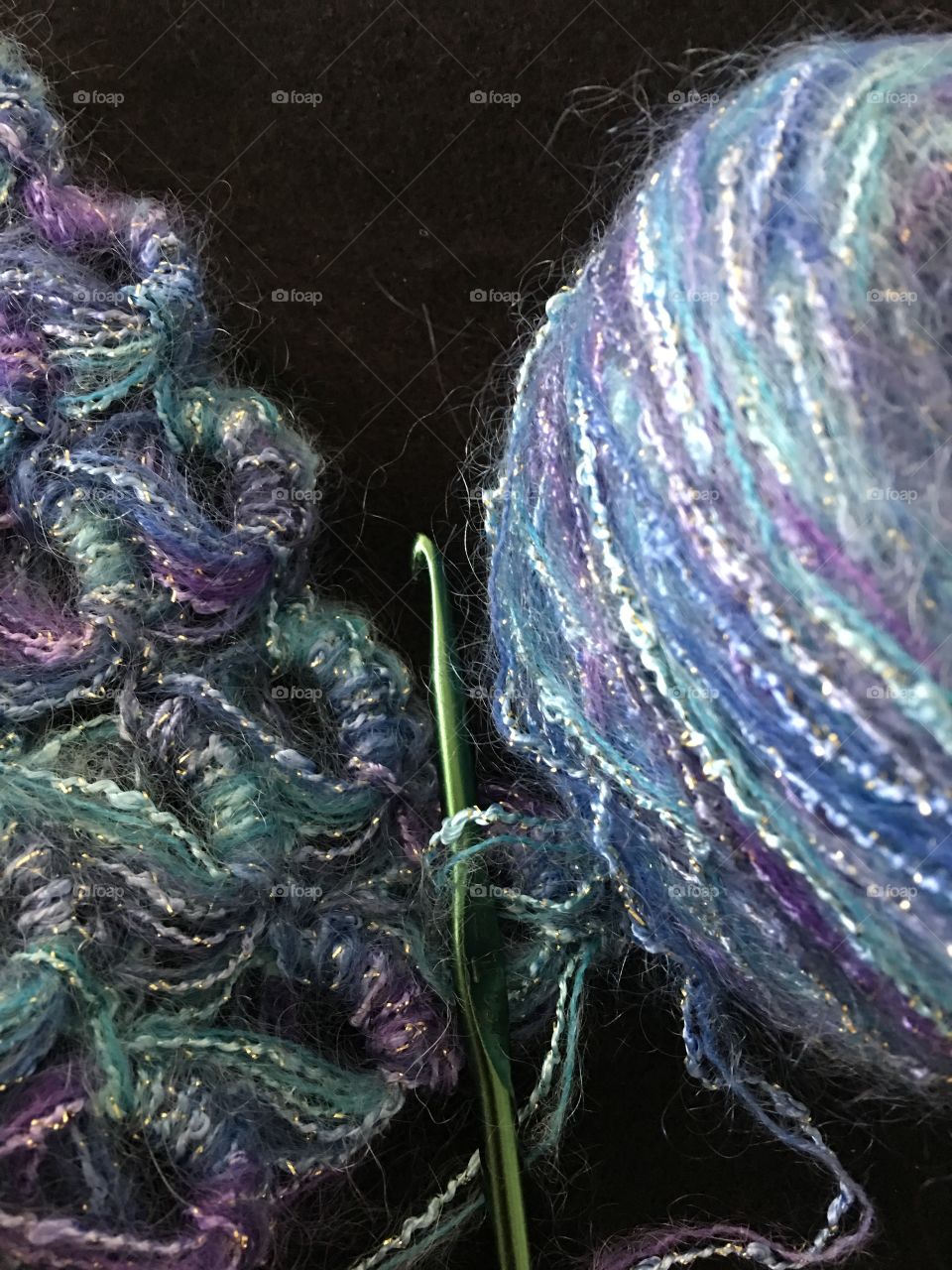 Yarn with crochet hook and broomstick lace