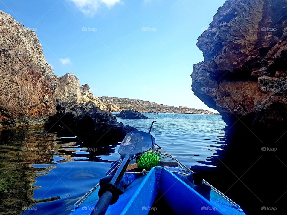 kayaking in blue water on a beautiful summer day