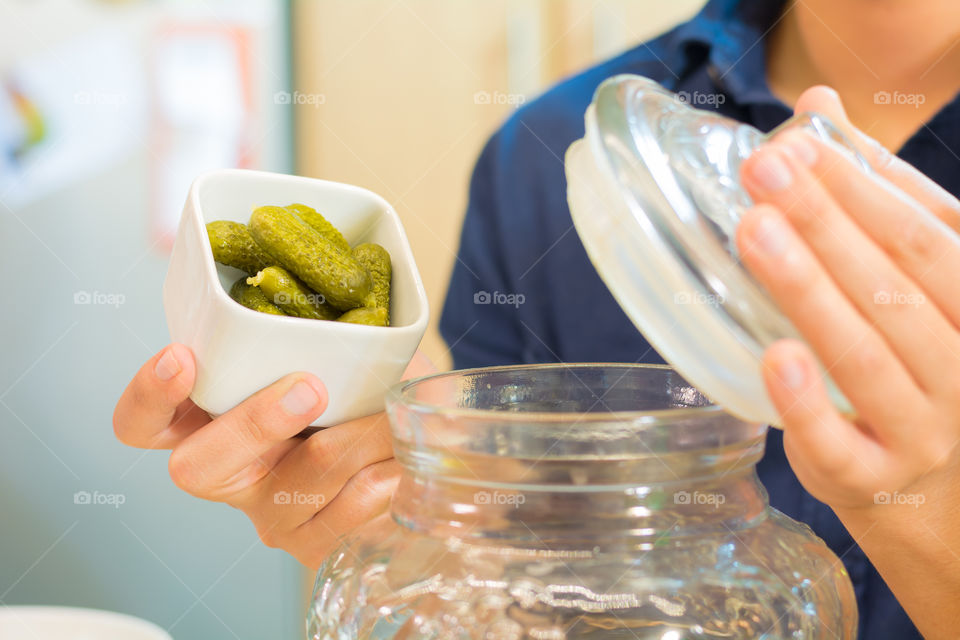 Hand holding pickle bowl