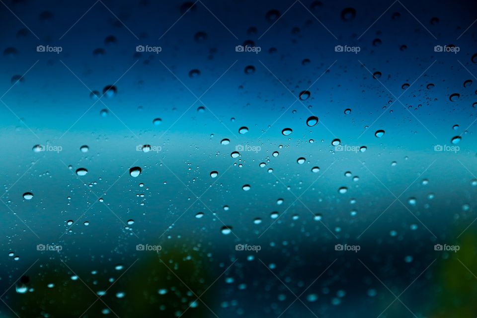Raindrop on glass window