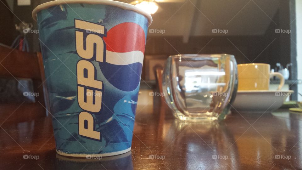 pepsi cup on table